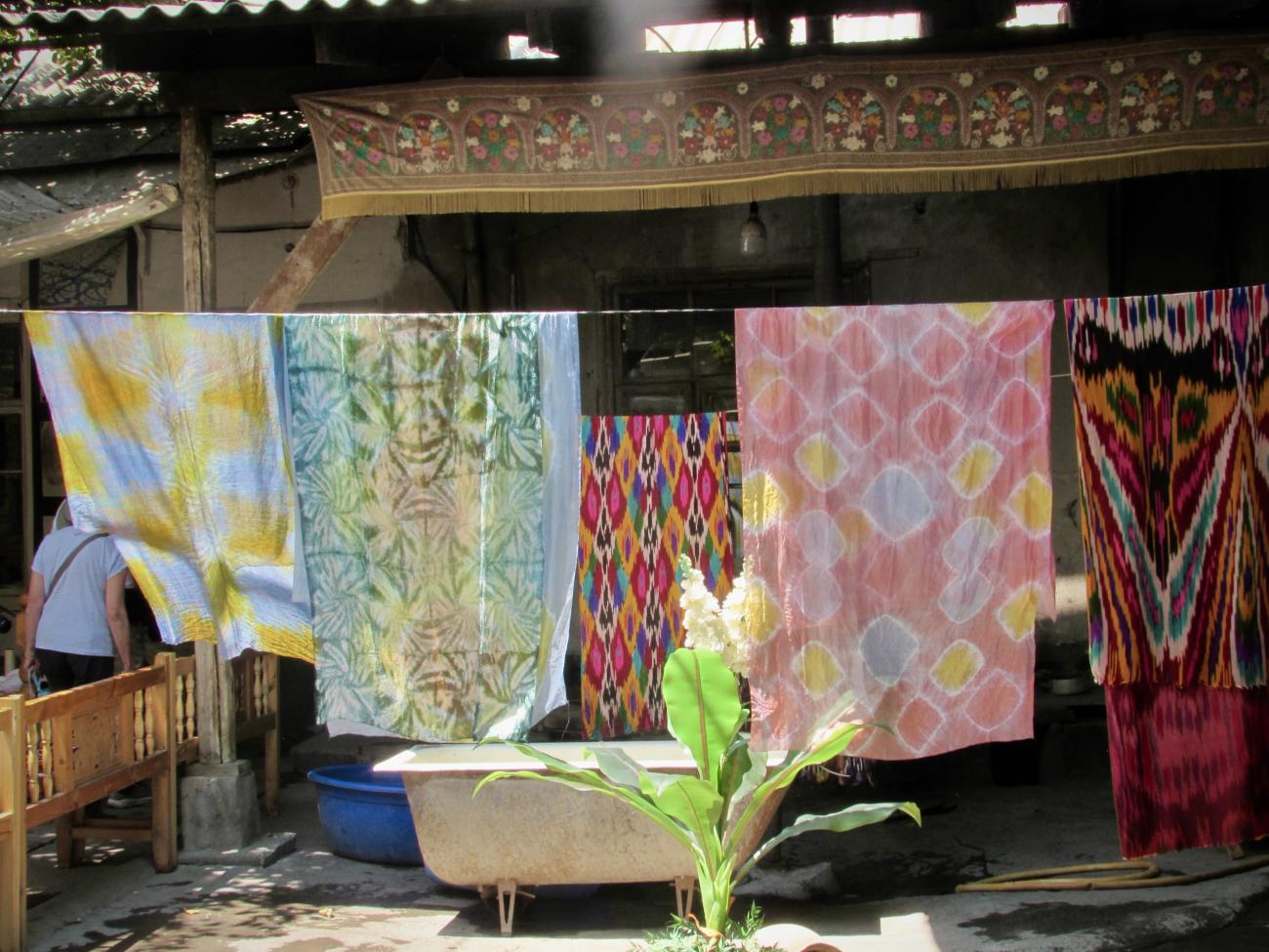 Tie dyed Uzbek silk hanging to dry on a clothes line